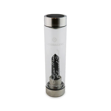 Capricorn Laterra Gemstone Water Bottle with obsidian crystal attachment inside clear glass bottle on white background.